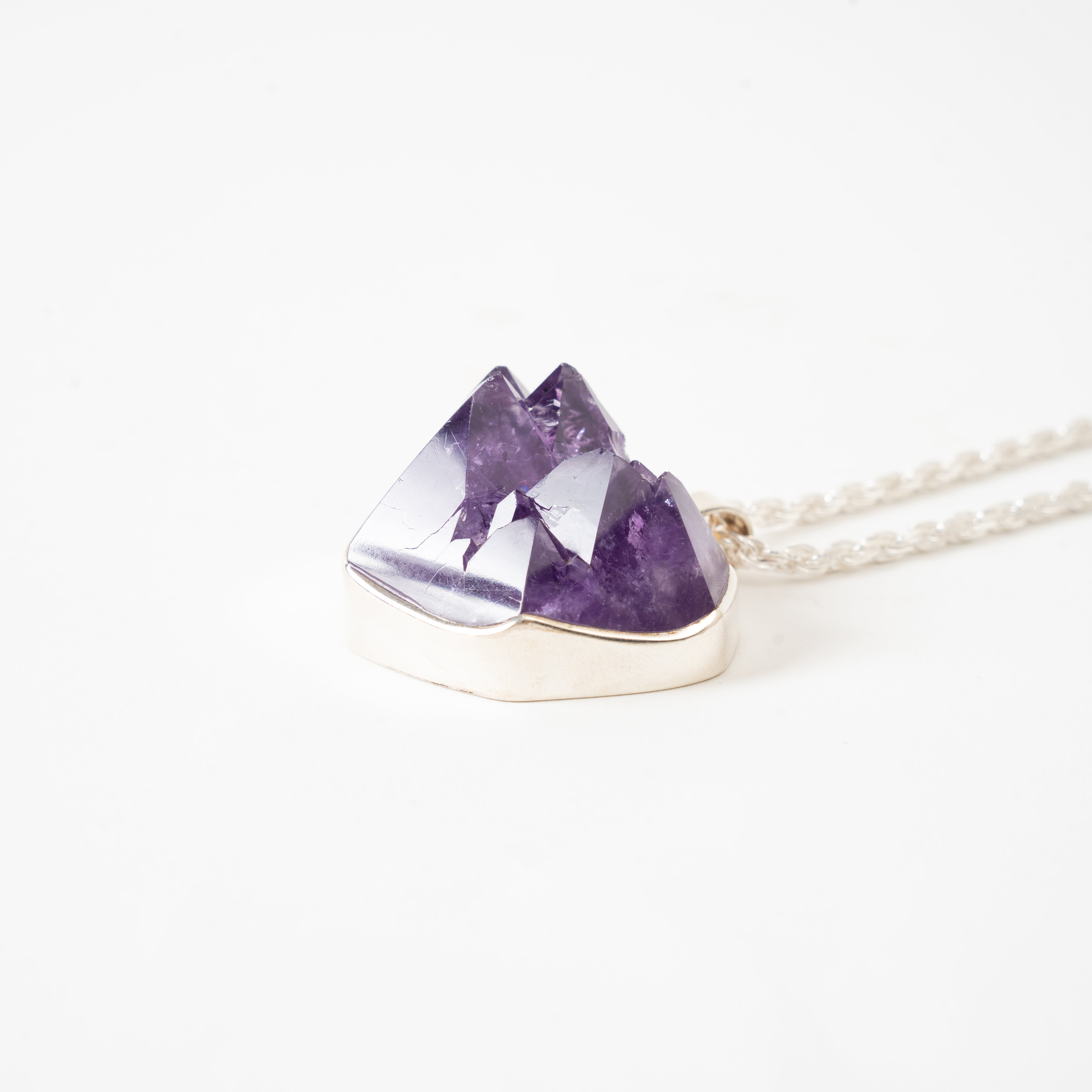 Amethyst crystal Cluster necklace on a white background Side View