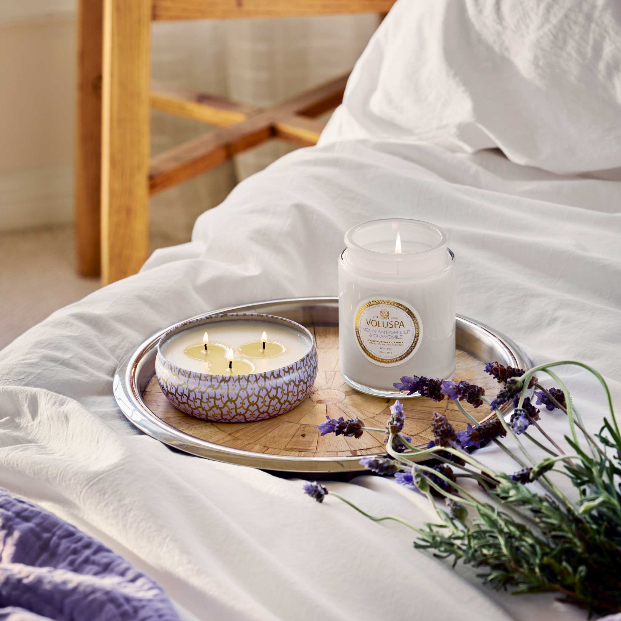 Mountain Lavender and Chamomile Large Jar Candle 18 oz on bed