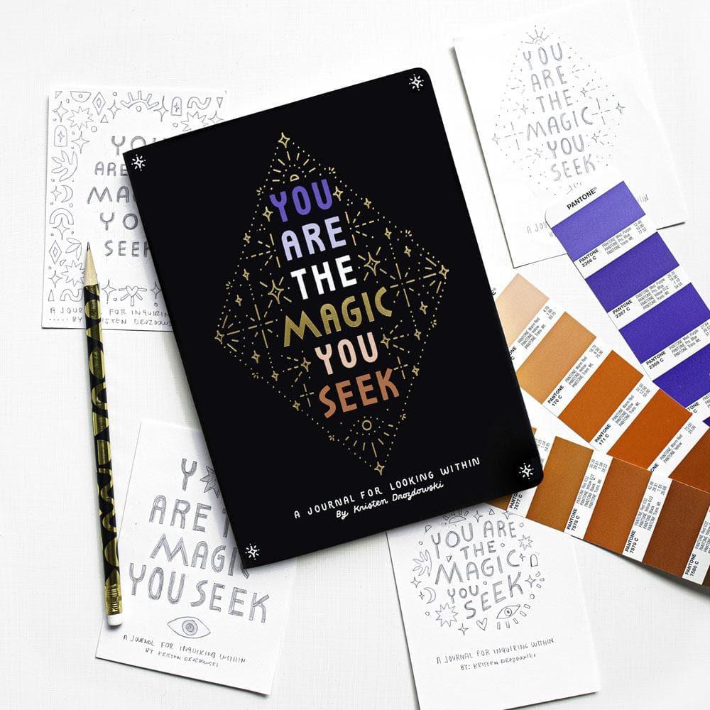You Are  The Magic You Seek Journal Laying on Table with Pencil  beside It.